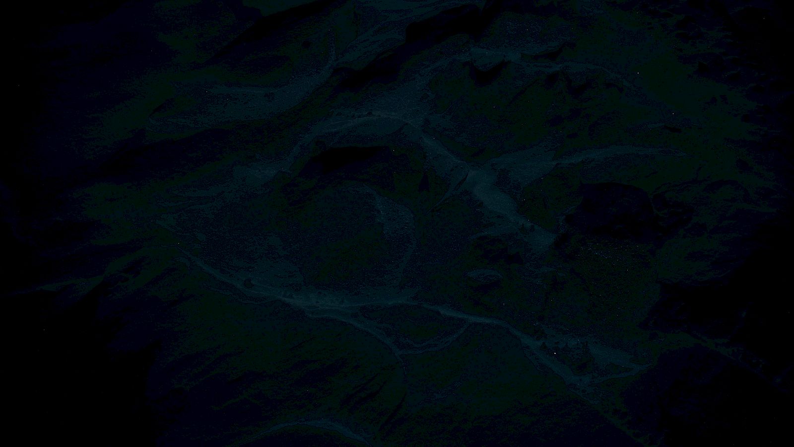 The image is very dark, making it difficult to distinguish specific details or objects clearly.